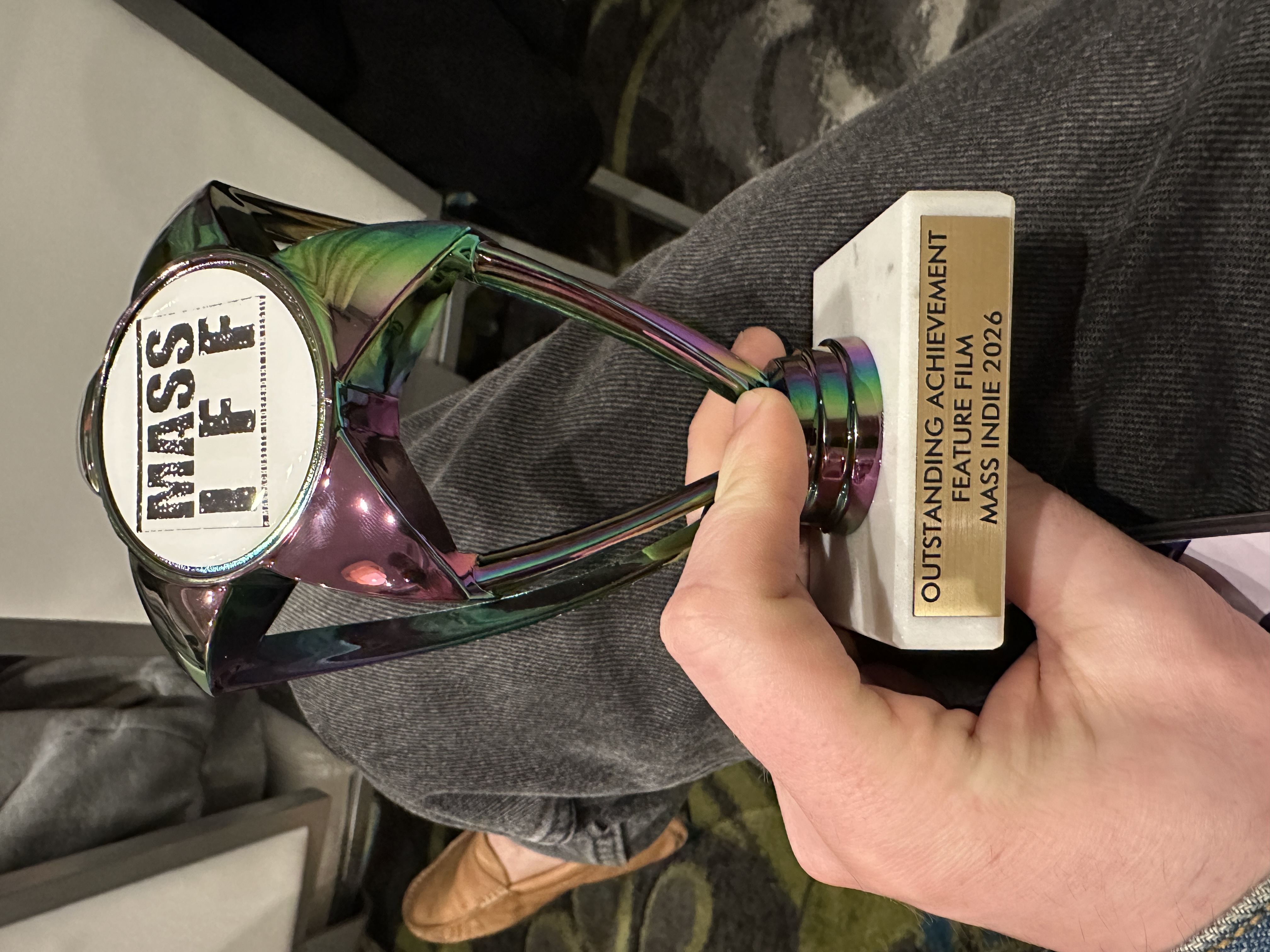 Holding the Outstanding Achievement trophy