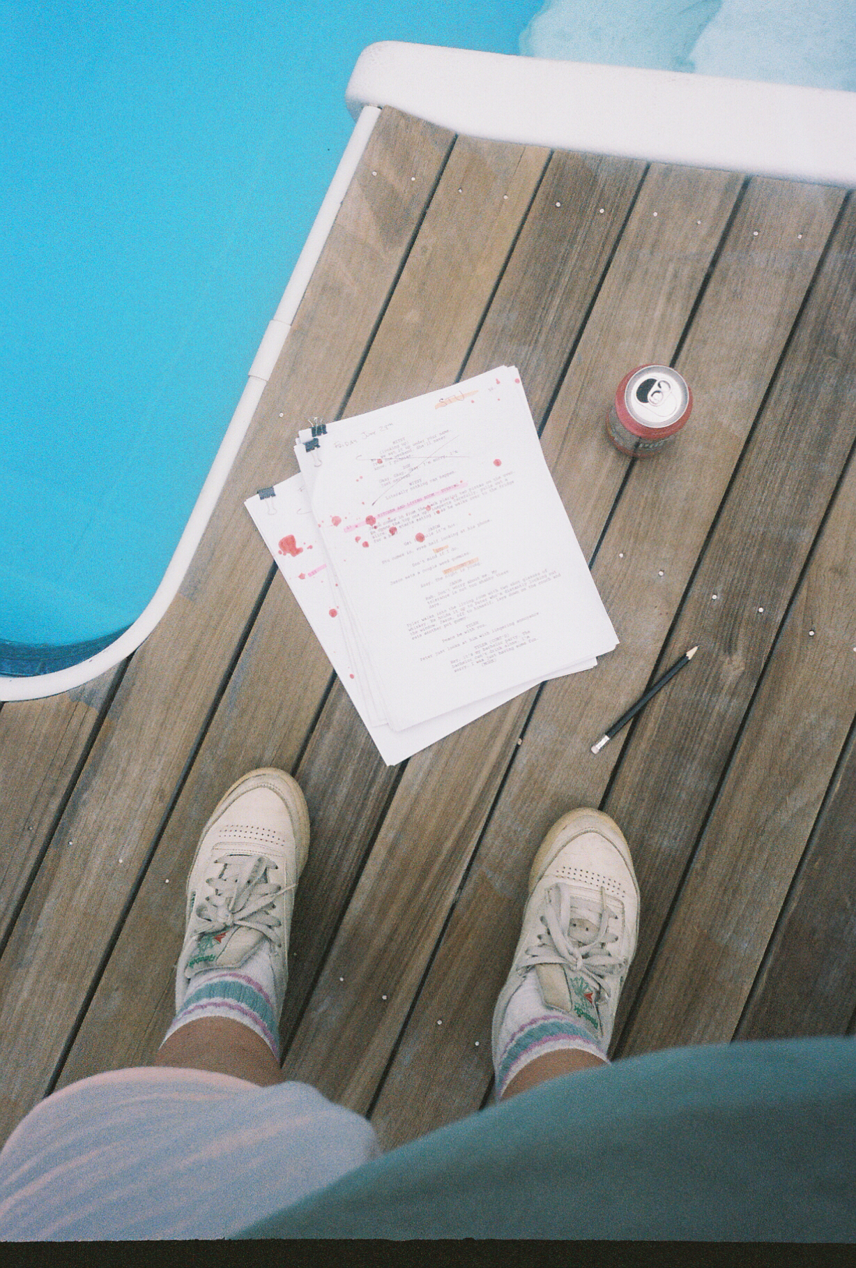 Script pages and a beer by the pool